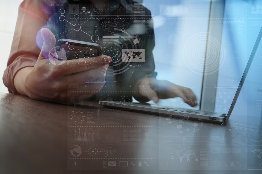 Double exposure of businessman hand working with mobile phone and modern computer and business strategy as concept